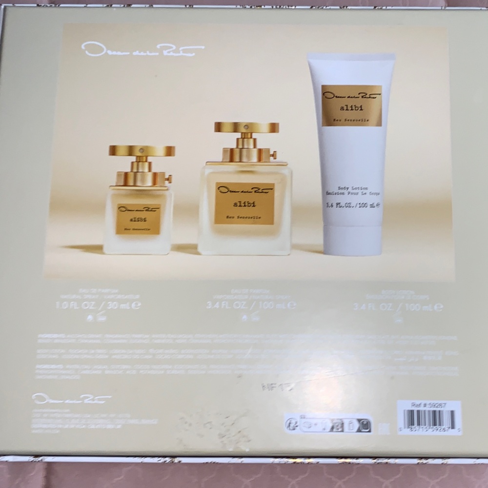 Oscar de la Renta Alibi Eau Sensuelle in White and Gold